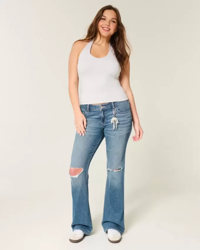 Niedrig sitzende Bootcut-Jeans mit Rissen in mittlerer Waschung Niedrig sitzende Bootcut-Jeans mit Rissen in mittlerer Waschung