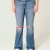 Niedrig sitzende Bootcut-Jeans mit Rissen in mittlerer Waschung Niedrig sitzende Bootcut-Jeans mit Rissen in mittlerer Waschung