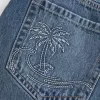Niedrig sitzender Mini-Skort aus besticktem Denim Niedrig sitzender Mini-Skort aus besticktem Denim