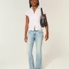 Niedrige Bootcut-Jeans mit mittlerer Waschung und Schmetterlingsstickerei Niedrige Bootcut-Jeans mit mittlerer Waschung und Schmetterlingsstickerei