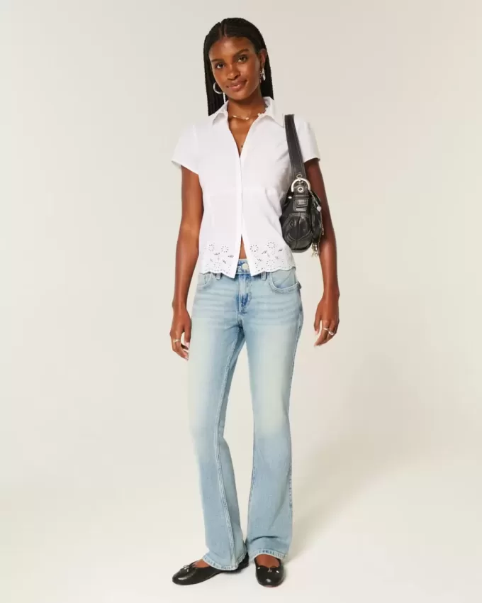 Niedrige Bootcut-Jeans mit mittlerer Waschung und Schmetterlingsstickerei Niedrige Bootcut-Jeans mit mittlerer Waschung und Schmetterlingsstickerei