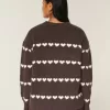 Oversize-Pullover mit Rundhalsausschnitt und Herzmuster Oversize-Pullover mit Rundhalsausschnitt und Herzmuster