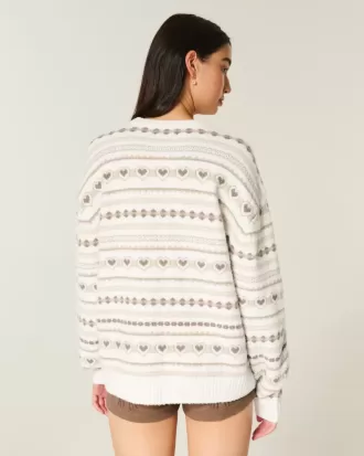 Oversize-Pullover mit Rundhalsausschnitt und Herzmuster Oversize-Pullover mit Rundhalsausschnitt und Herzmuster
