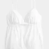 Schimmerndes Babydoll-Oberteil mit Stickerei Schimmerndes Babydoll-Oberteil mit Stickerei