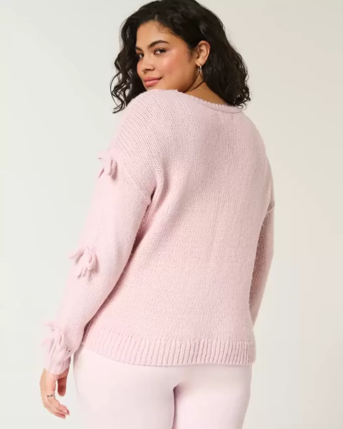 Schulterfreier Pullover mit Schleifenapplikation