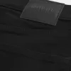 Schwarze, verblassungsfreie Super Skinny Jeans
