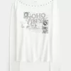 SoHo-Top mit Grafik und Schlitzausschnitt und Nieten SoHo-Top mit Grafik und Schlitzausschnitt und Nieten