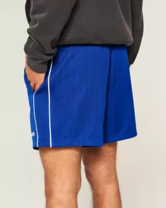 Strick-Fußballshorts mit Logo bis zur Mitte des Oberschenkels
