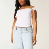 Tief sitzende Baggy-Jeans mit heller Waschung und Schleifengrafik Tief sitzende Baggy-Jeans mit heller Waschung und Schleifengrafik