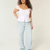 Tief sitzende Baggy-Jeans mit heller Waschung und Sternstickerei Tief sitzende Baggy-Jeans mit heller Waschung und Sternstickerei
