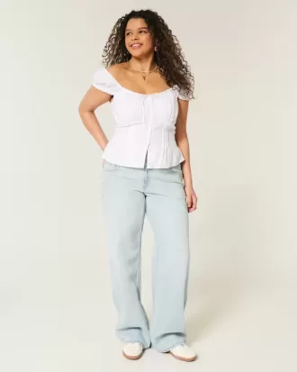Tief sitzende Baggy-Jeans mit heller Waschung und Sternstickerei