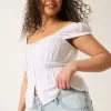 Tief sitzende Baggy-Jeans mit heller Waschung und Sternstickerei Tief sitzende Baggy-Jeans mit heller Waschung und Sternstickerei