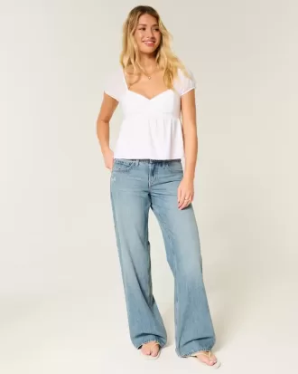 Tief sitzende Baggy-Jeans mit Schmetterlingsgrafik in mittlerer Waschung