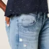 Ultra Low-Rise Distressed Light Wash Flare Jeans mit Pailletten Ultra Low-Rise Distressed Light Wash Flare Jeans mit Pailletten