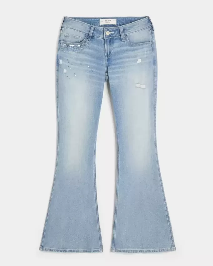 Ultra Low-Rise Distressed Light Wash Flare Jeans mit Pailletten Ultra Low-Rise Distressed Light Wash Flare Jeans mit Pailletten