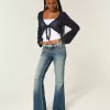 Ultra Low-Rise Schlagjeans mit mittlerer Waschung und Stickerei Ultra Low-Rise Schlagjeans mit mittlerer Waschung und Stickerei