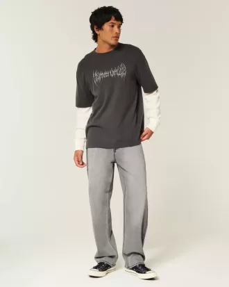 Verwaschene schwarze Baggy-Jeans mit Grafik und Verzierung