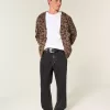 Verwaschene schwarze Baggy-Jeans mit Nieten Verwaschene schwarze Baggy-Jeans mit Nieten