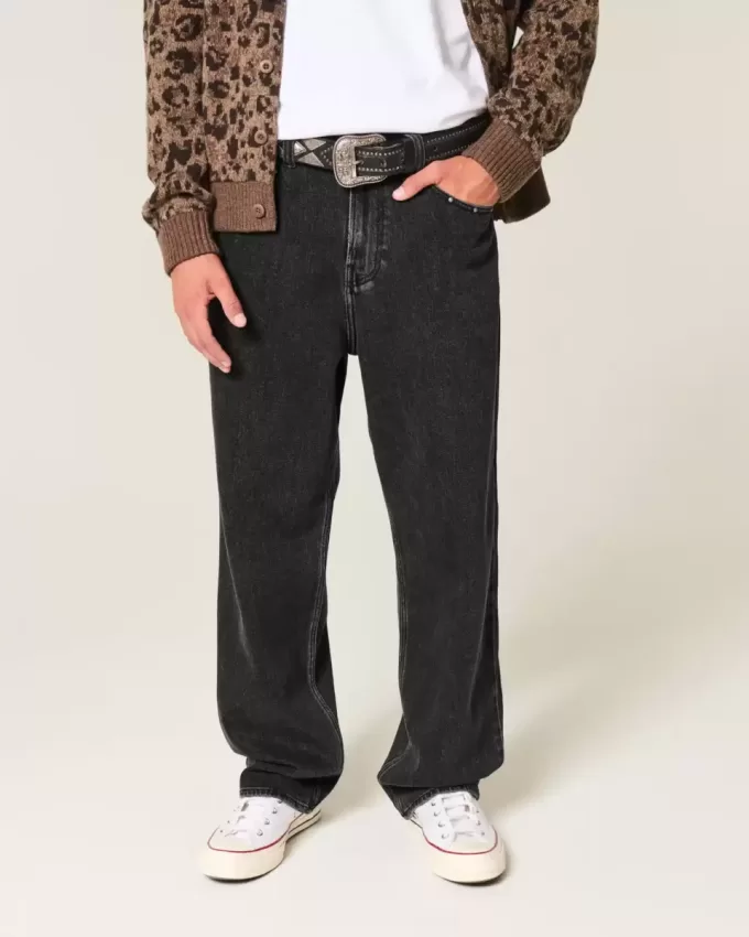 Verwaschene schwarze Baggy-Jeans mit Nieten Verwaschene schwarze Baggy-Jeans mit Nieten