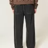 Verwaschene schwarze Baggy-Jeans mit Nieten Verwaschene schwarze Baggy-Jeans mit Nieten