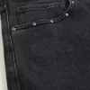 Verwaschene schwarze Baggy-Jeans mit Nieten Verwaschene schwarze Baggy-Jeans mit Nieten