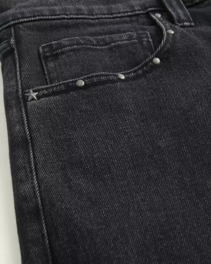 Verwaschene schwarze Baggy-Jeans mit Nieten Verwaschene schwarze Baggy-Jeans mit Nieten
