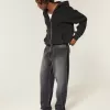 Verwaschene schwarze Skater-Baggy-Jeans mit Logo-Grafik Verwaschene schwarze Skater-Baggy-Jeans mit Logo-Grafik