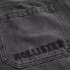 Verwaschene schwarze Skater-Baggy-Jeans mit Logo-Grafik Verwaschene schwarze Skater-Baggy-Jeans mit Logo-Grafik