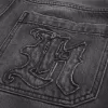 Verwaschene schwarze Skater-Baggy-Jeans mit Logo-Grafik Verwaschene schwarze Skater-Baggy-Jeans mit Logo-Grafik