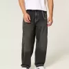 Verwaschene schwarze Skater-Baggy-Jeans mit Schlangenstickerei Verwaschene schwarze Skater-Baggy-Jeans mit Schlangenstickerei