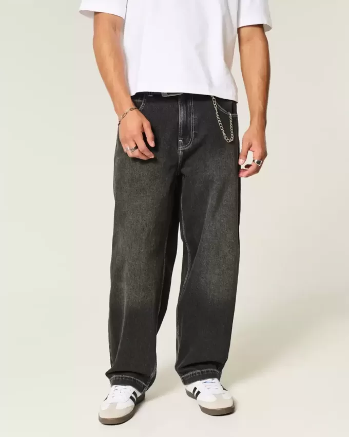 Verwaschene schwarze Skater-Baggy-Jeans mit Schlangenstickerei Verwaschene schwarze Skater-Baggy-Jeans mit Schlangenstickerei