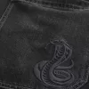 Verwaschene schwarze Skater-Baggy-Jeans mit Schlangenstickerei Verwaschene schwarze Skater-Baggy-Jeans mit Schlangenstickerei