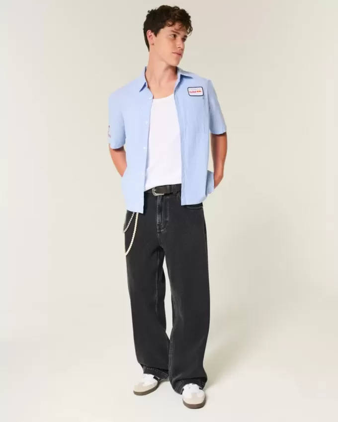 Verwaschene schwarze Super Baggy-Jeans mit Sterngrafik Verwaschene schwarze Super Baggy-Jeans mit Sterngrafik