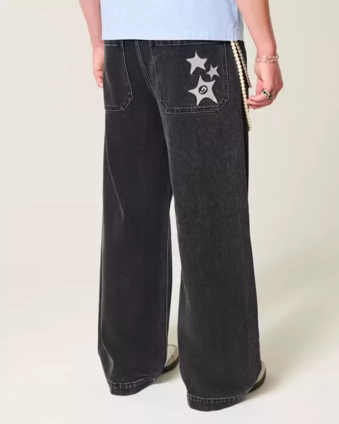 Verwaschene schwarze Super Baggy-Jeans mit Sterngrafik Verwaschene schwarze Super Baggy-Jeans mit Sterngrafik