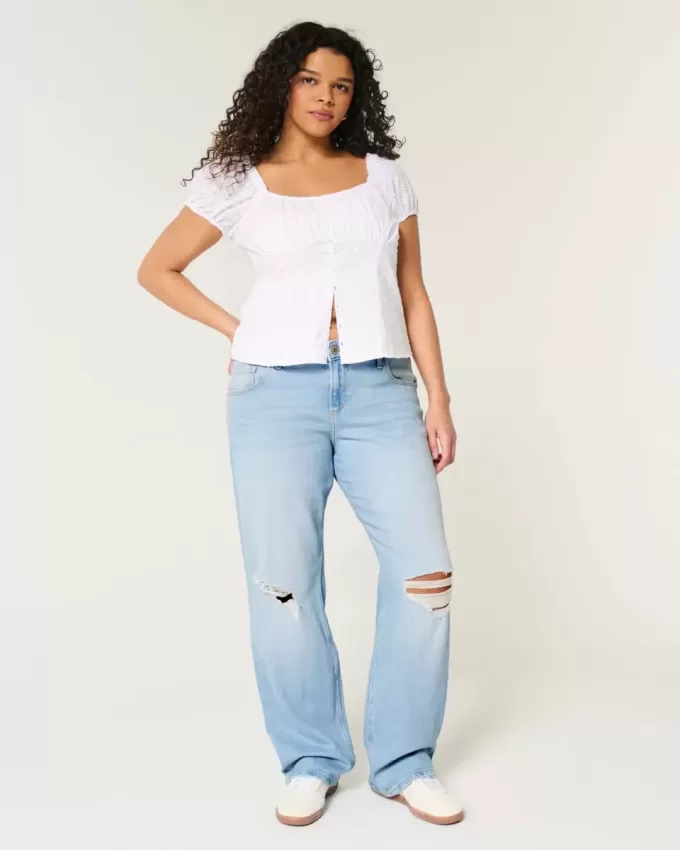 Zerrissene, lockere Straight-Jeans mit niedriger Taille und heller Waschung Zerrissene, lockere Straight-Jeans mit niedriger Taille und heller Waschung