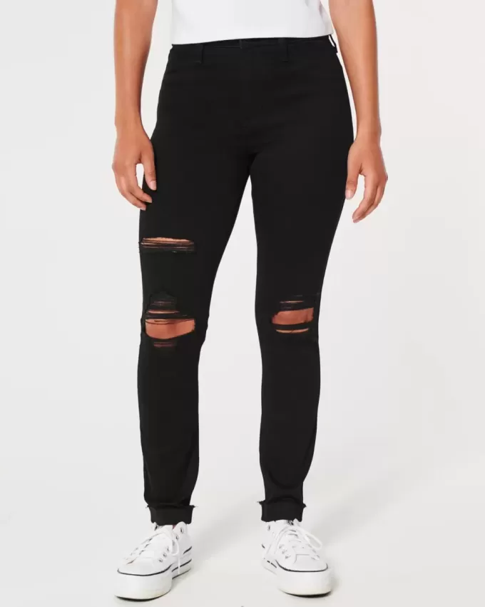 Zerrissene schwarze Jeans-Leggings mit hohem Bund Zerrissene schwarze Jeans-Leggings mit hohem Bund