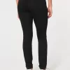 Zerrissene schwarze Jeans-Leggings mit hohem Bund Zerrissene schwarze Jeans-Leggings mit hohem Bund