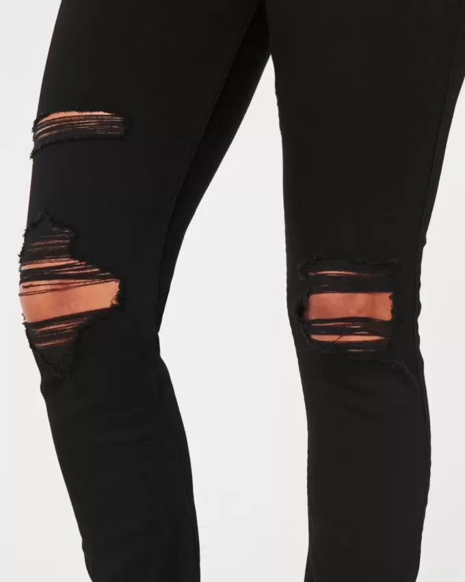 Zerrissene schwarze Jeans-Leggings mit hohem Bund Zerrissene schwarze Jeans-Leggings mit hohem Bund