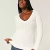 Zopfmuster-Pullover mit V-Ausschnitt und Symbol Zopfmuster-Pullover mit V-Ausschnitt und Symbol