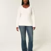 Zopfmuster-Pullover mit V-Ausschnitt und Symbol Zopfmuster-Pullover mit V-Ausschnitt und Symbol