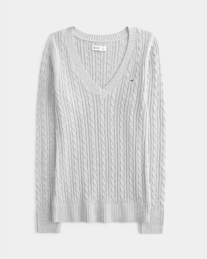 Zopfmuster-Pullover mit V-Ausschnitt und Symbol Zopfmuster-Pullover mit V-Ausschnitt und Symbol