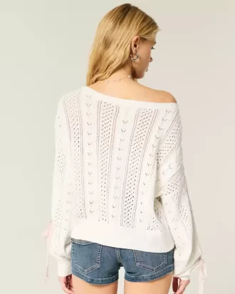 Zopfmusterpullover mit Schleifenärmeln Zopfmusterpullover mit Schleifenärmeln