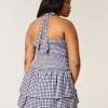 Zweilagiges, gesmoktes Neckholder-Skortkleid Zweilagiges, gesmoktes Neckholder-Skortkleid